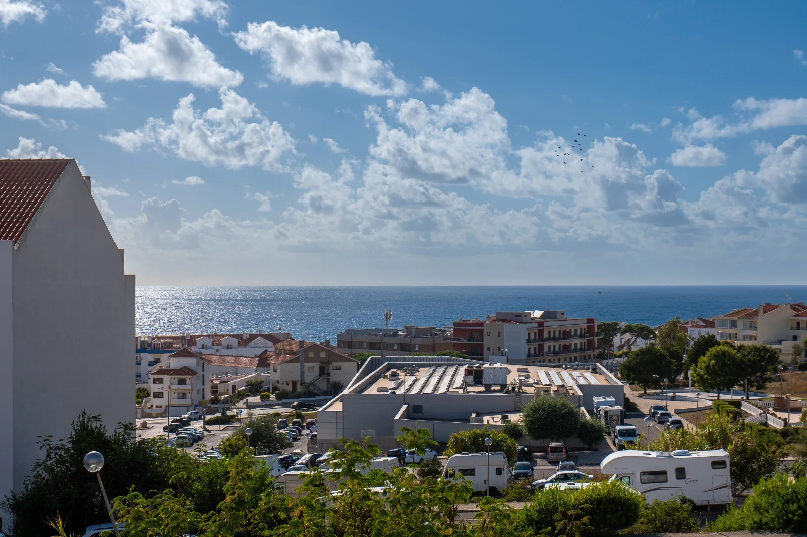 Ocean view over the rooftops of Ericeira, photographed from the property