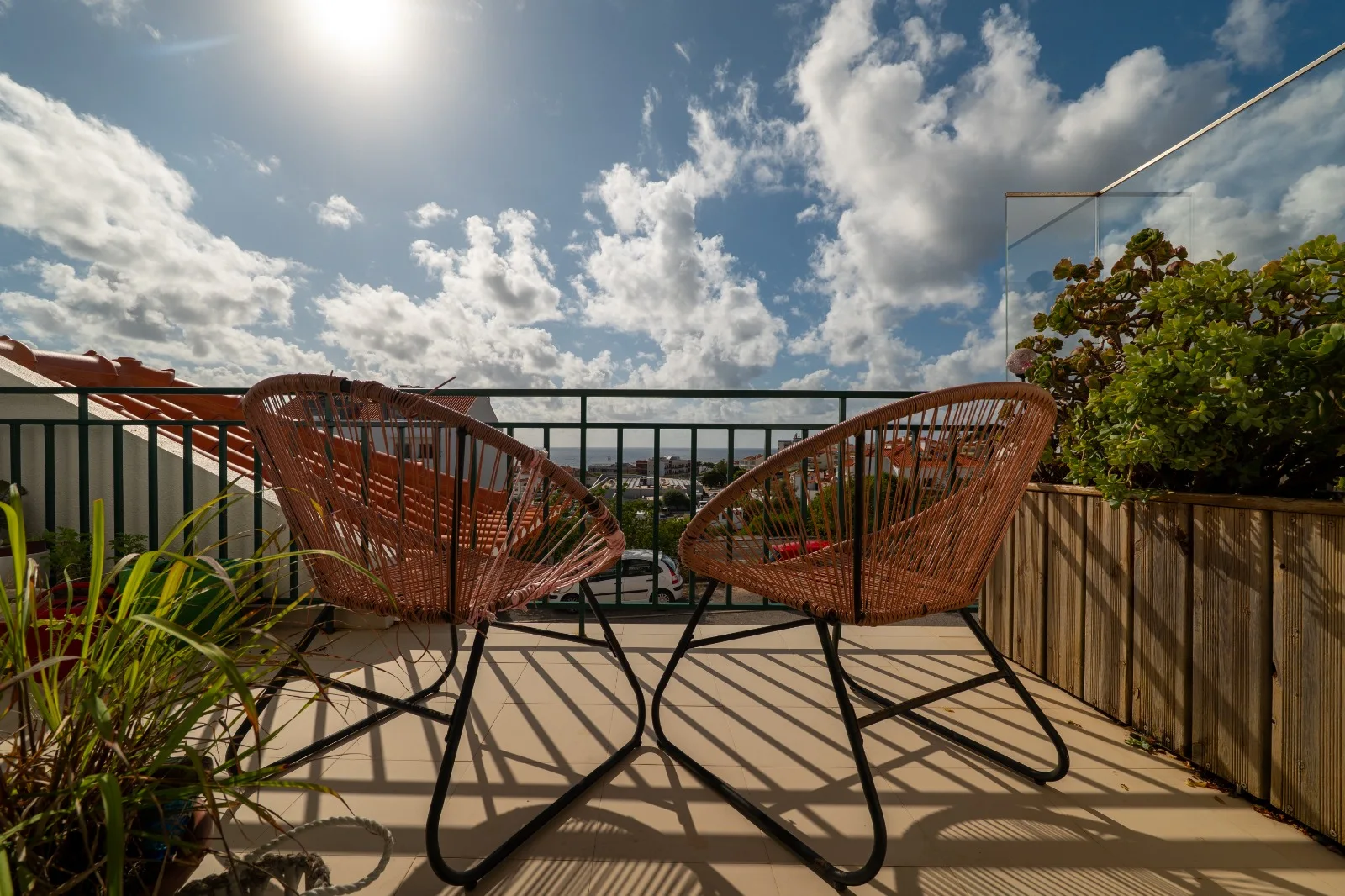 Apartment balcony with chairs overlooking Ericeira and the Atlantic Ocean